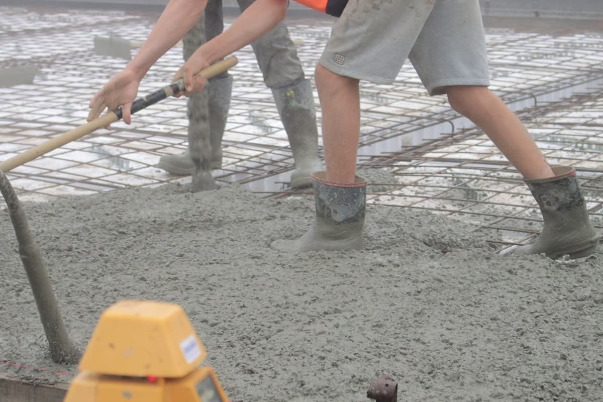 Concrete crew placing and levelling a replacement pour